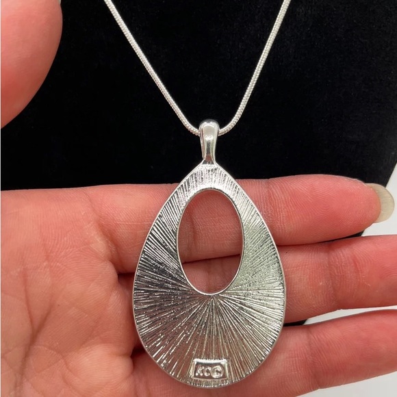 A Silver-Tone Simulated Polished Abalone and Rhinestone Kenneth Cole Necklace - Picture 5 of 10